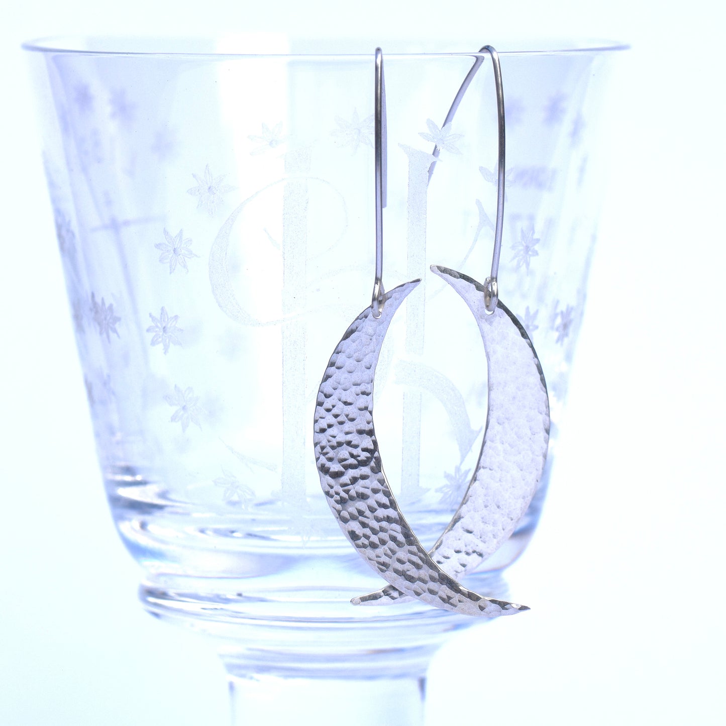 Silver crescent moon dangle earrings