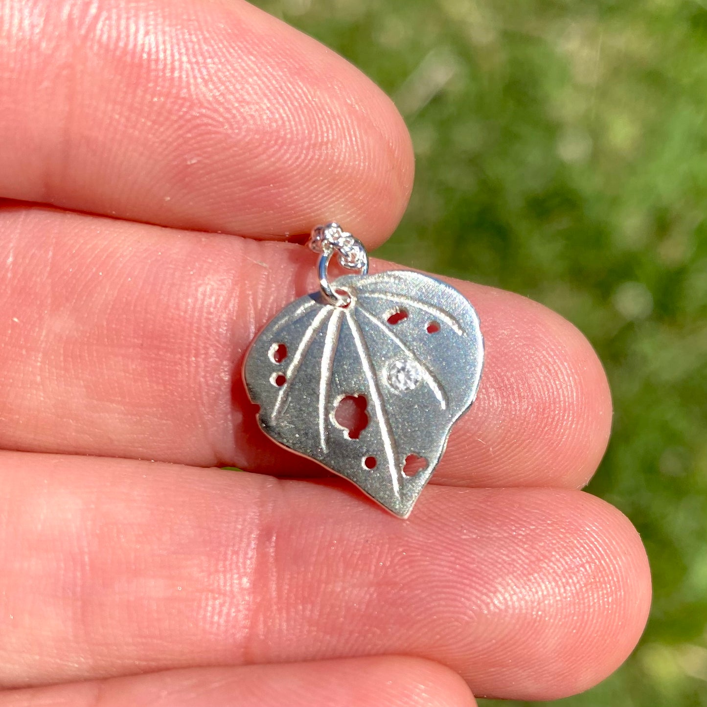 Sterling silver kawakawa pendant with tiny cubic zirconia