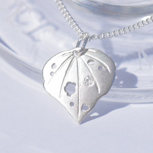 Sterling silver kawakawa pendant with tiny cubic zirconia