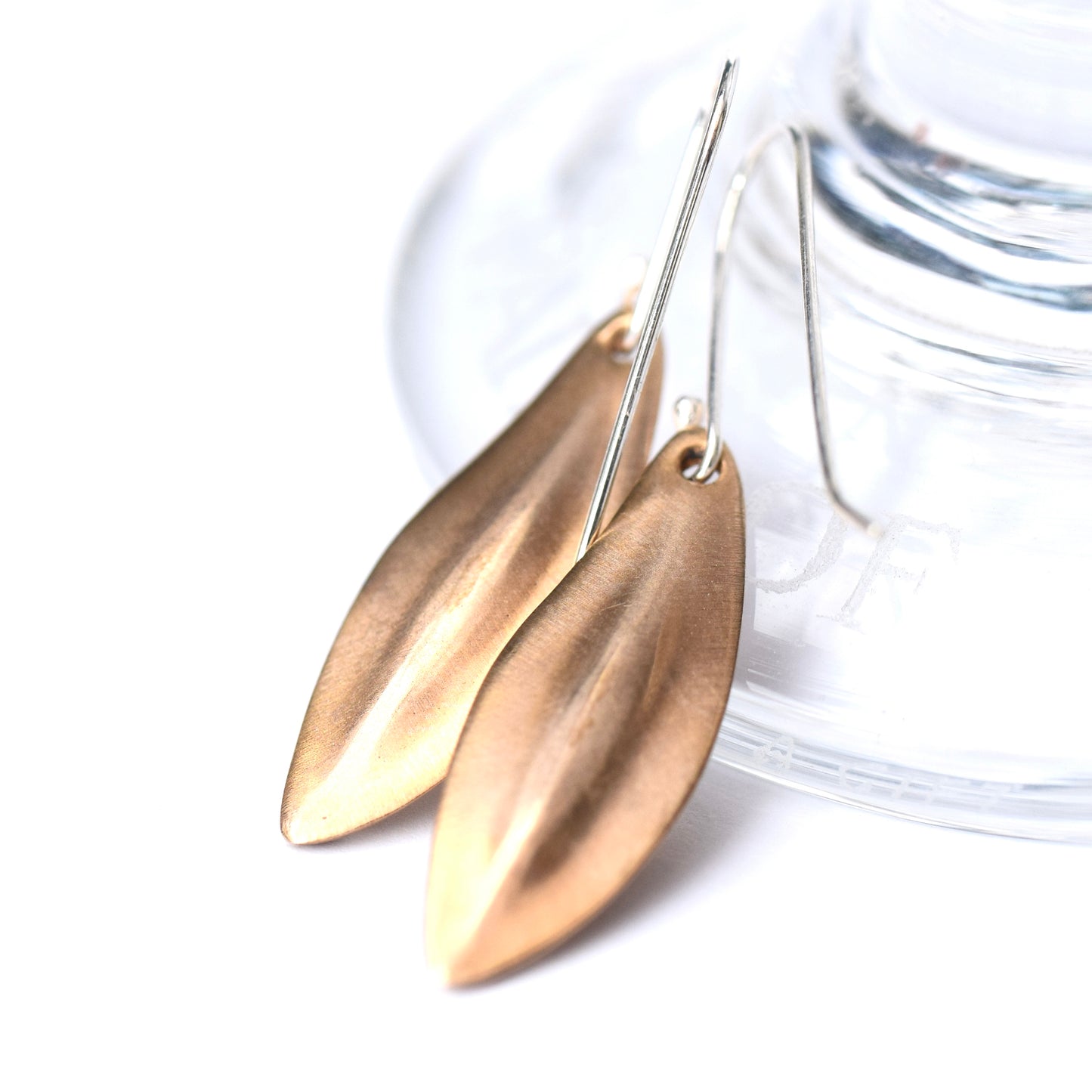Seed pod earrings in brass