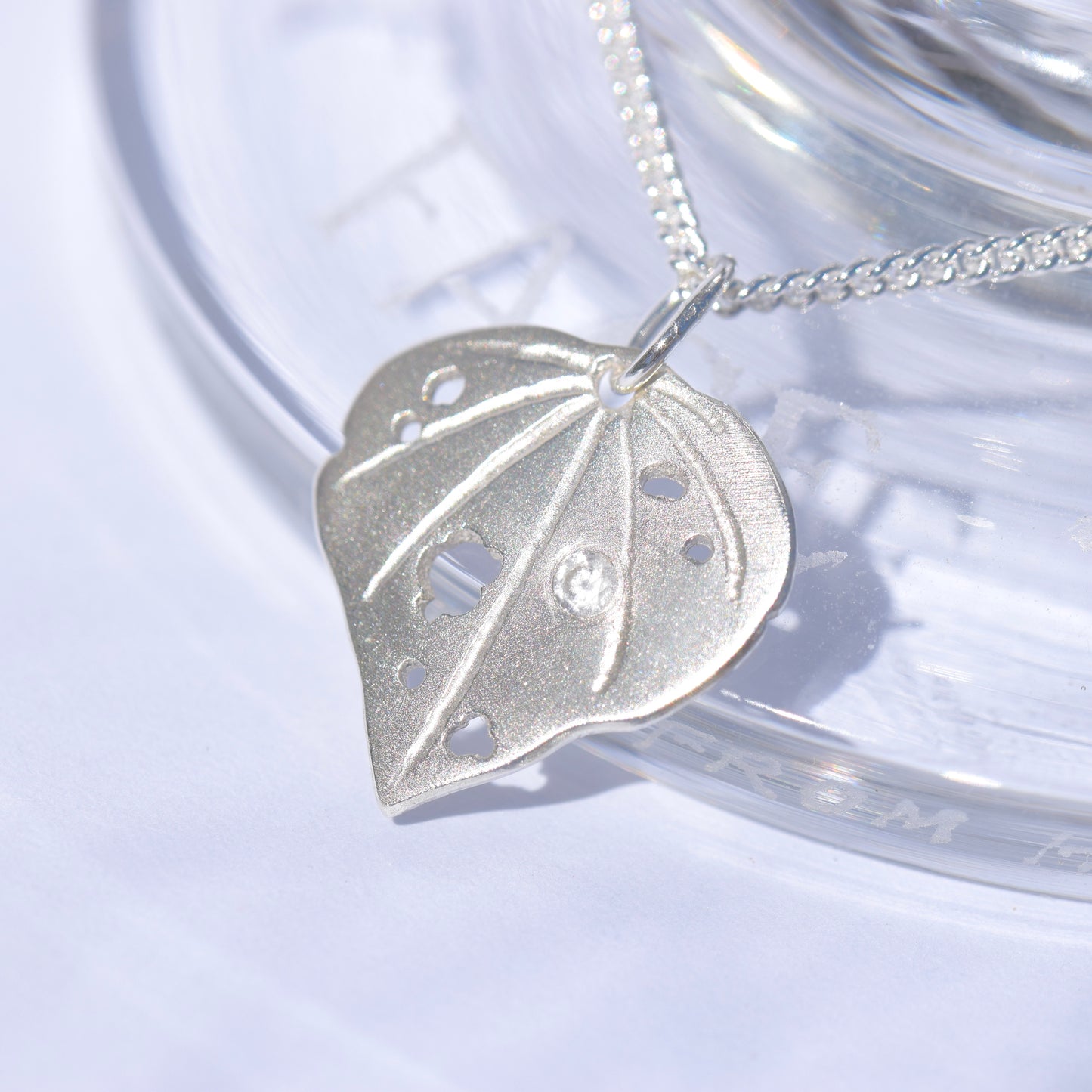 Sterling silver kawakawa pendant with tiny cubic zirconia