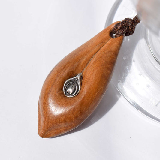 Vulva necklace in wood